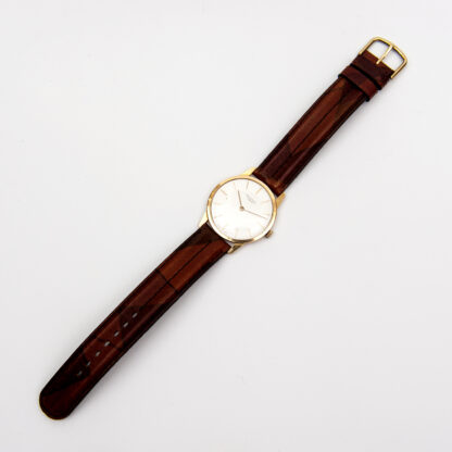 UNIVERSAL GENEVE. Reloj de pulsera unisex. Oro 18k. Suiza, 1964.