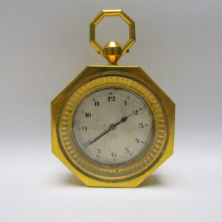 OCTO. Reloj de Sobremesa o Carruaje Octogonal en metal dorado. Siete días marcha. Suiza, pps. siglo XX.